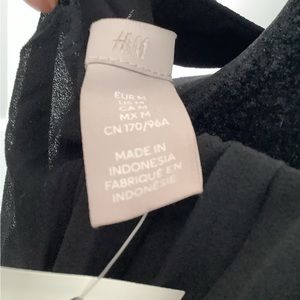 Little black dress, pleated with a halter top.  Great for summer nights